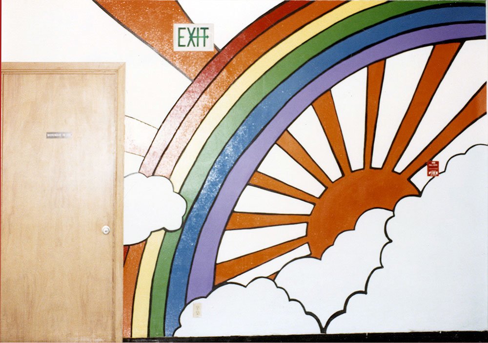 Rainbow mural on the north end of the of the hallway at Sherman Union High School by Kim Kaseberg and Cameron Kaseberg, 1980. Photo by Cameron Kaseberg.
