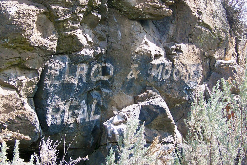 Elrod & Moore Real Estate ad painted on Lone Rock.