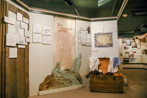 The Oregon Trails, Rails and Roads in Sherma County exhibit section banner and cutout. Photo by Cameron Kaseberg.