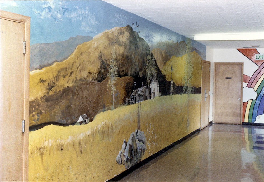 Country landscape by Nancy von Borstel and Cameron Kaseberg on the wall outside the cafeteria at Sherman Union High School, 1979.