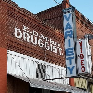 Photo of painted signage on the face of the E.D. McKee Druggist building.