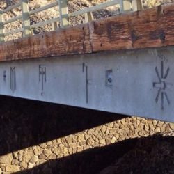 Photo of Native American images on Sherar&rsquo;s Bridge, crossing the Deschutes River between Sherman County and Wasco County.
